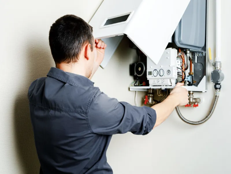 Technician performing an HVAC repair in Vacaville - Peter Levi