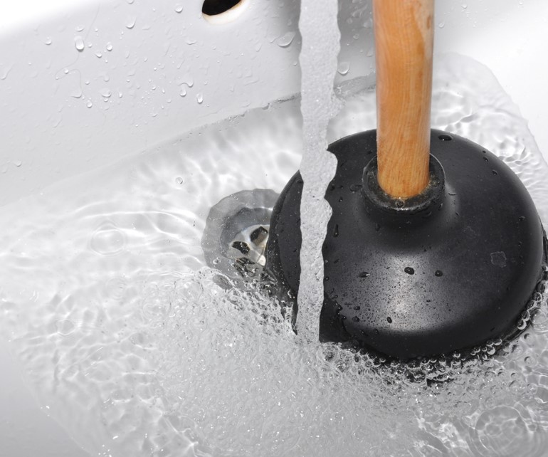 plunger fixing a clogged sink