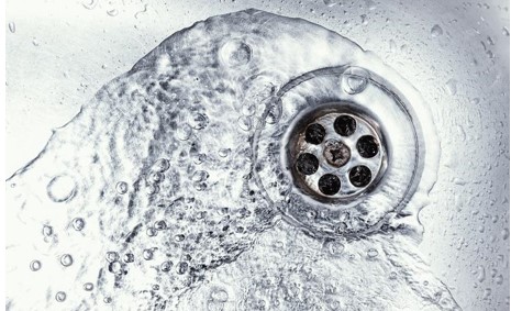 water swirling down a sink drain